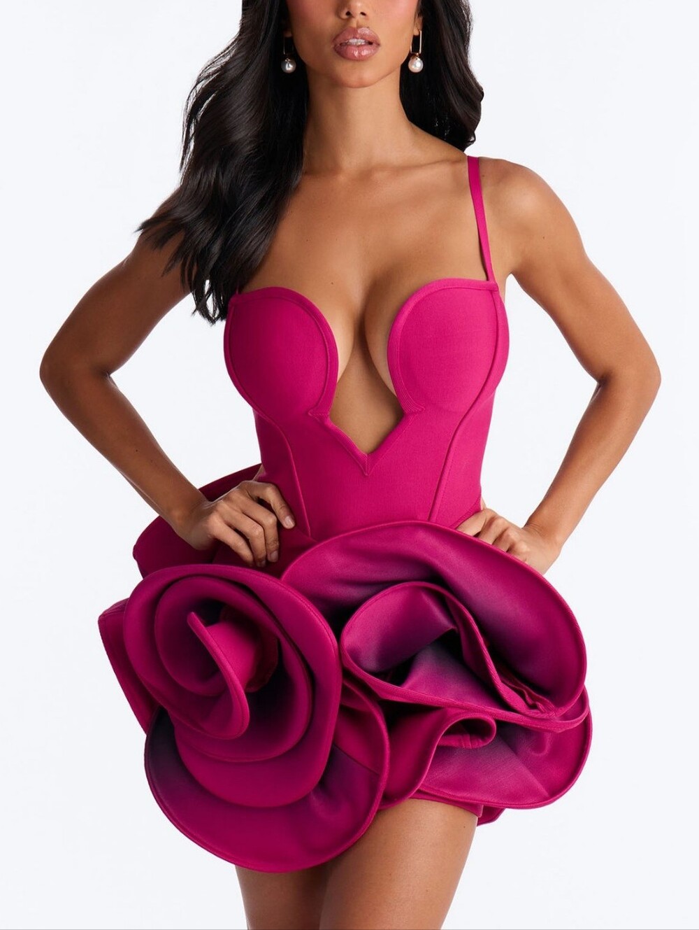A spectacular cocktail minidress in a rich pink (fuchsia) color, the main accent